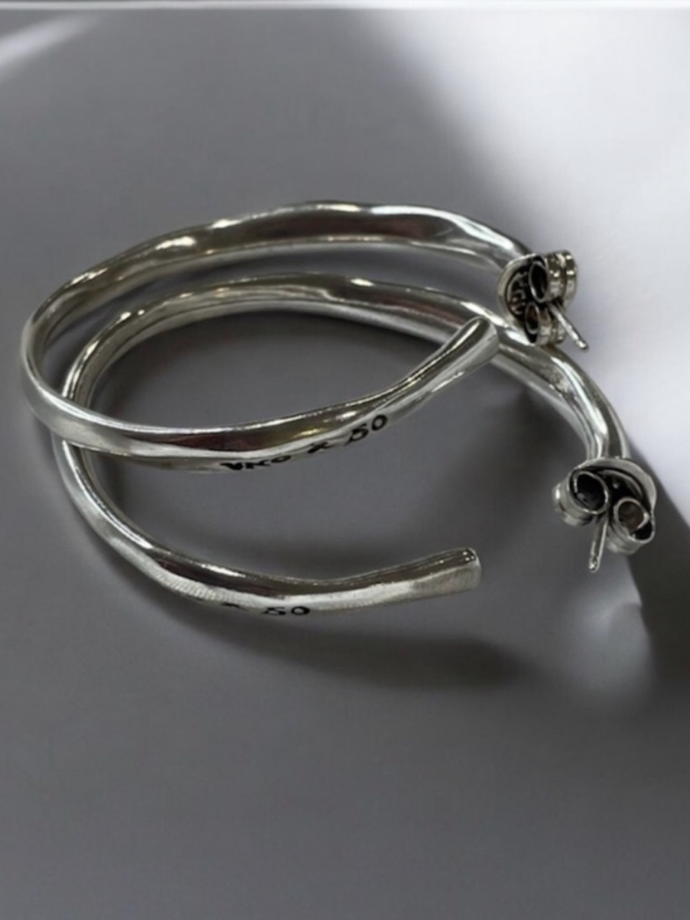 UNO de 50 Silver Spiral Hoop Earrings